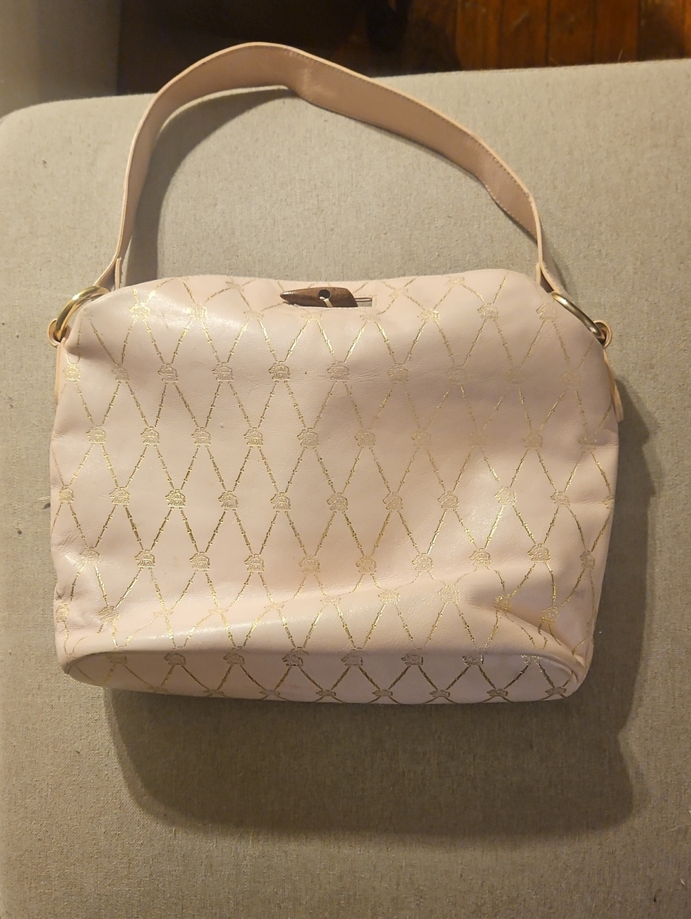 Tocca Elegant Pink Shoulder Bag with Gold Accents